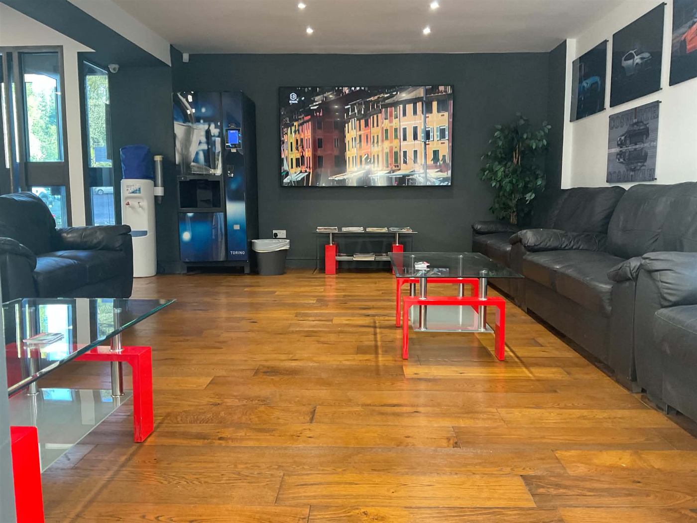 Customer waiting lounge at The Mill, Dawley, with sofas, TV, free hot drinks machine and water cooler