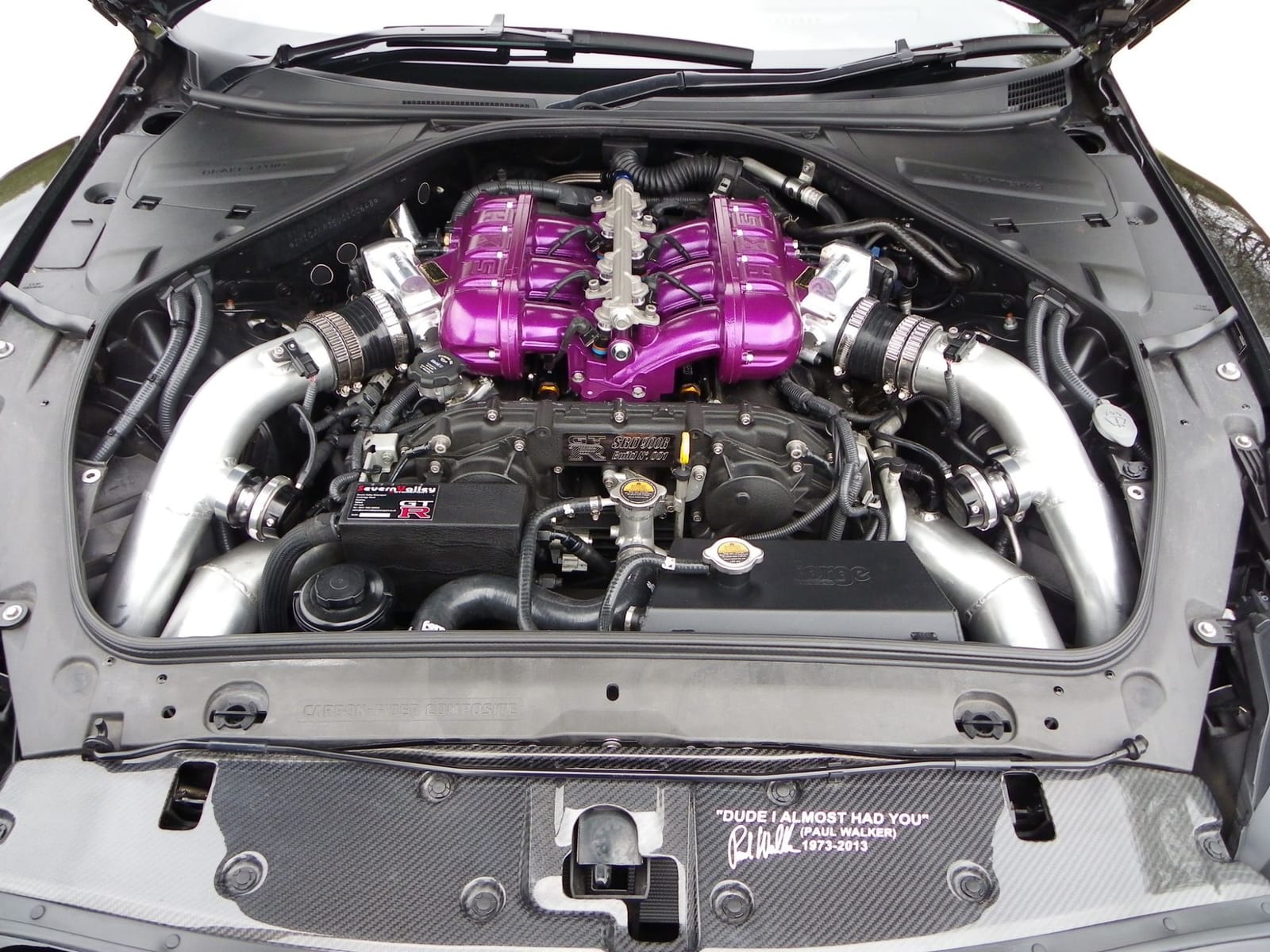 Modified Nissan GT-R engine bay with purple HKS intake plenum
