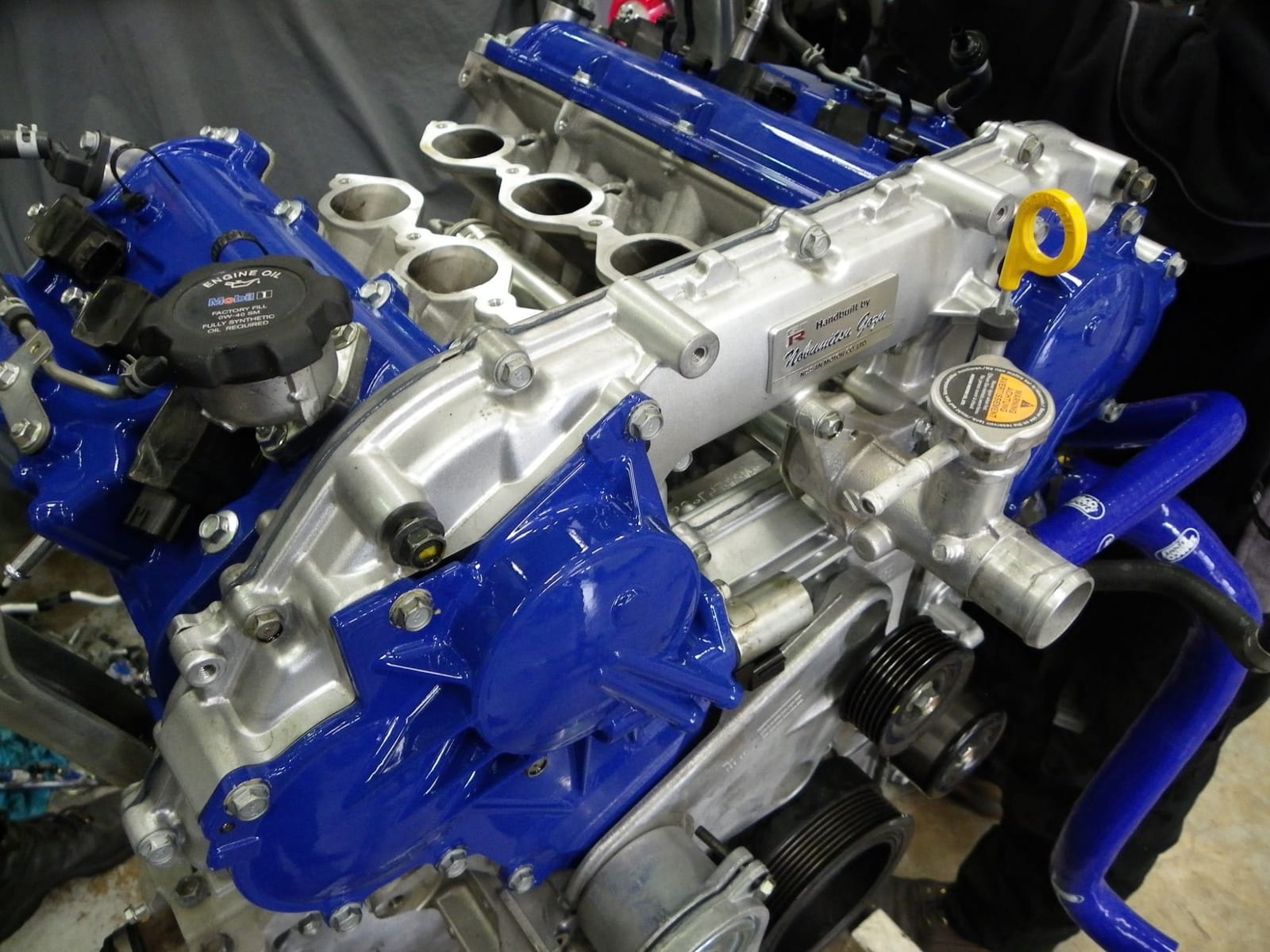 Hand-built Nissan VR38 engine with blue painted covers at Severn Valley Motorsport